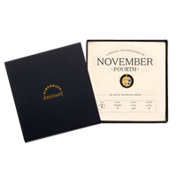 The November Fourth Pendant inside its box